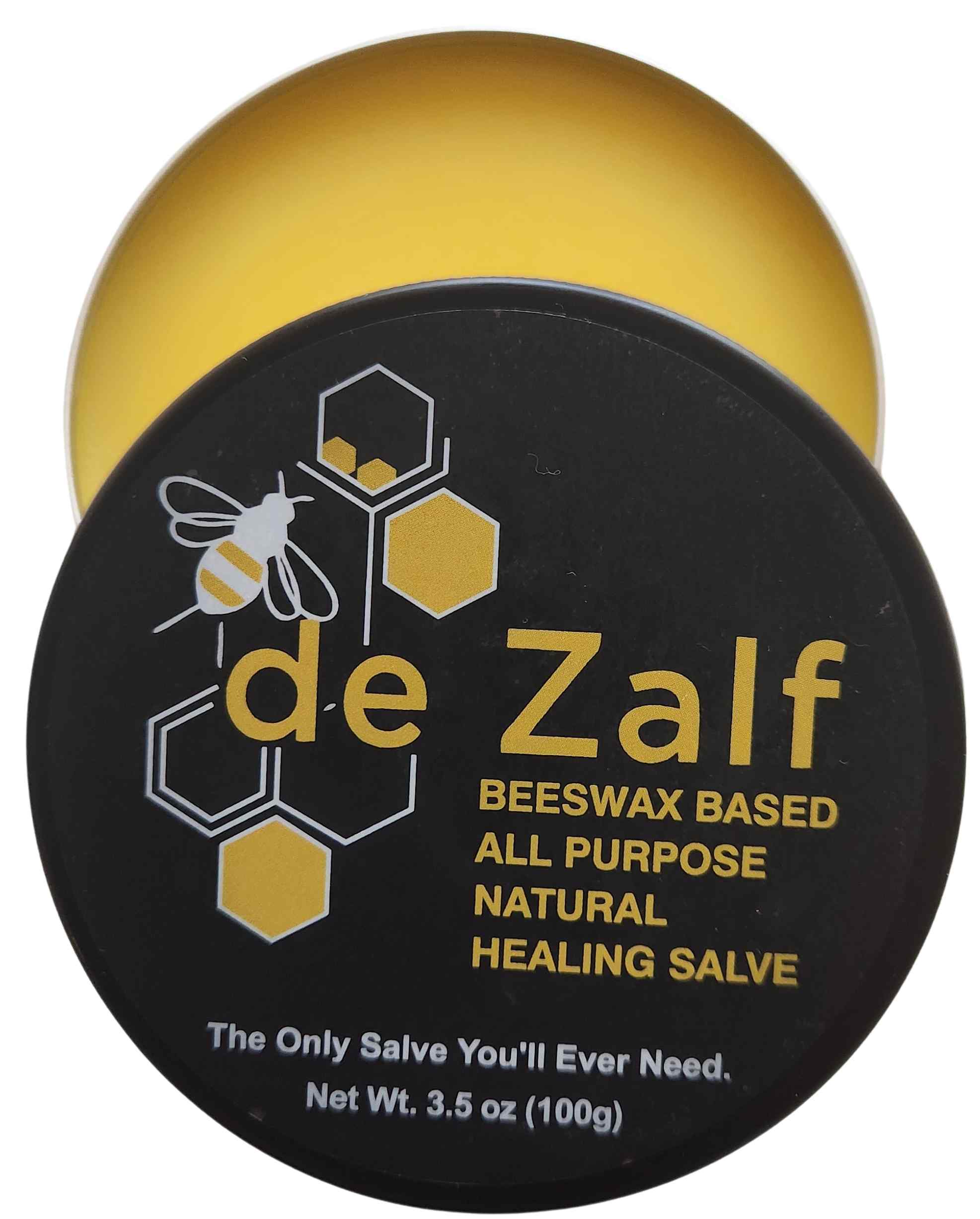 Black tin of deZalf natural soothing salve on a natural background